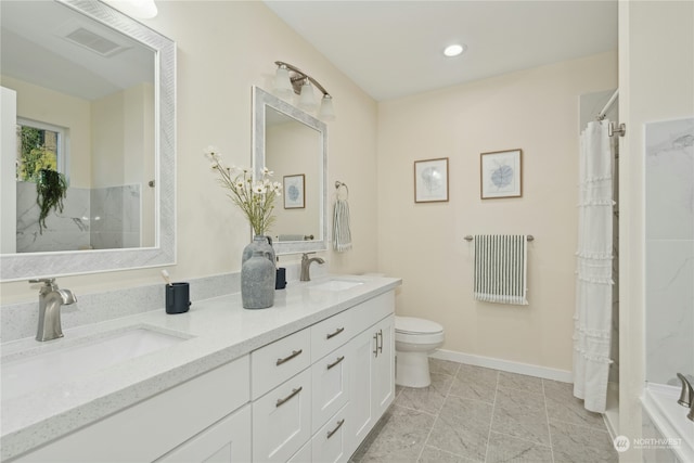 bathroom with vanity, toilet, and curtained shower