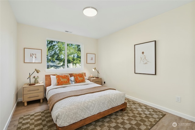 bedroom featuring wood-type flooring