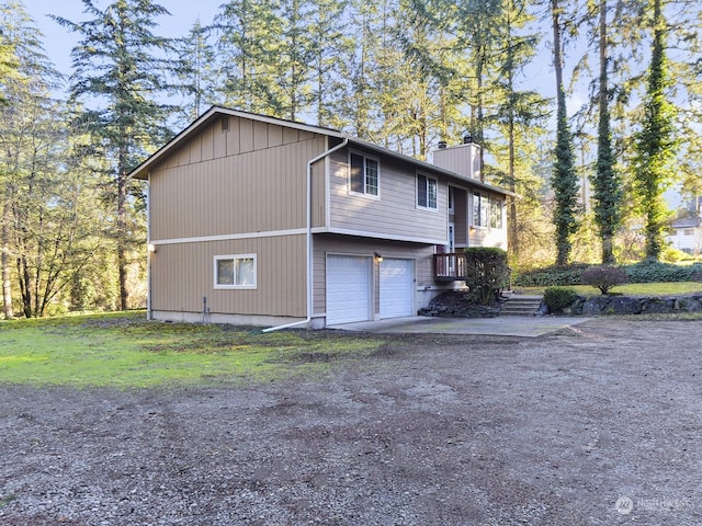 view of property exterior with a garage