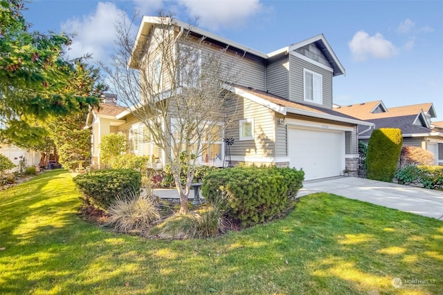 view of front of property with a garage and a front yard