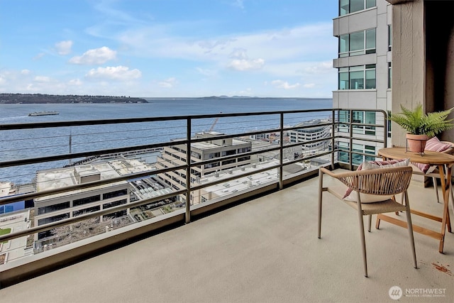 balcony featuring a water view