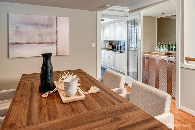 dining space with light wood-type flooring