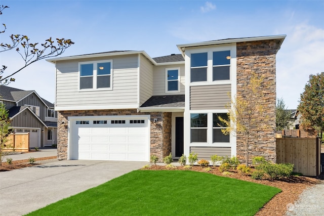 view of front of house with a garage and a front lawn