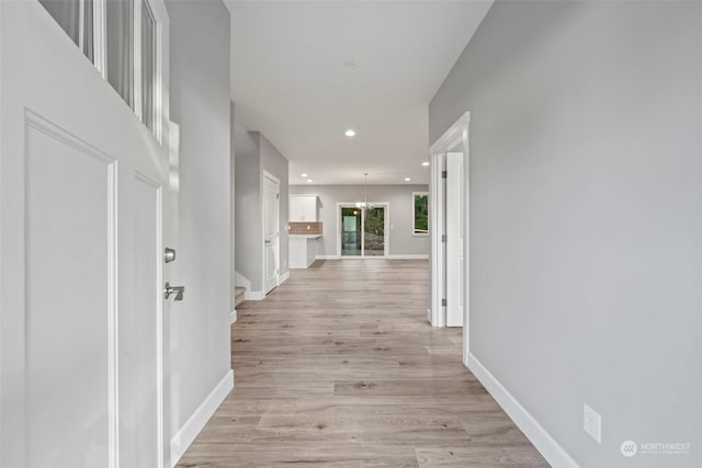 corridor featuring light wood-type flooring