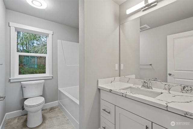 bathroom with vanity and toilet