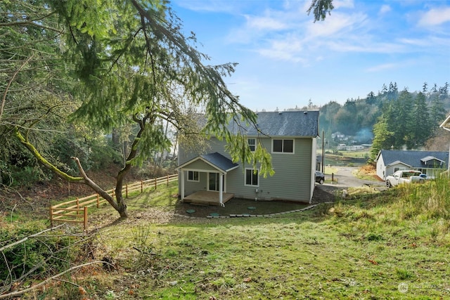 view of side of property featuring a yard