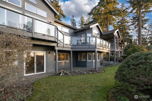 rear view of property with a yard