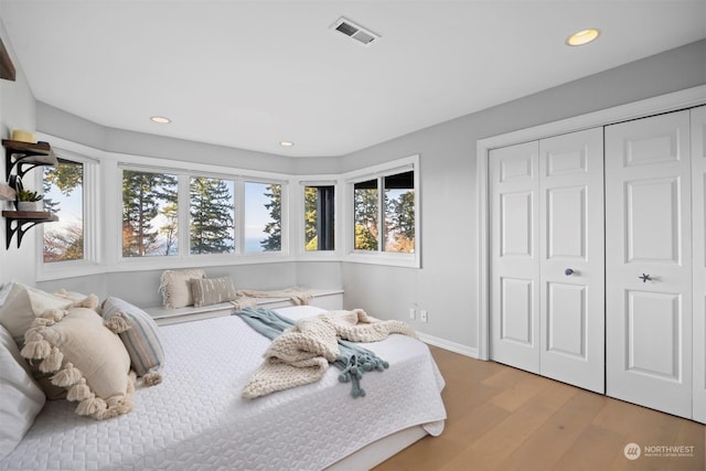 bedroom with a closet and light wood-type flooring