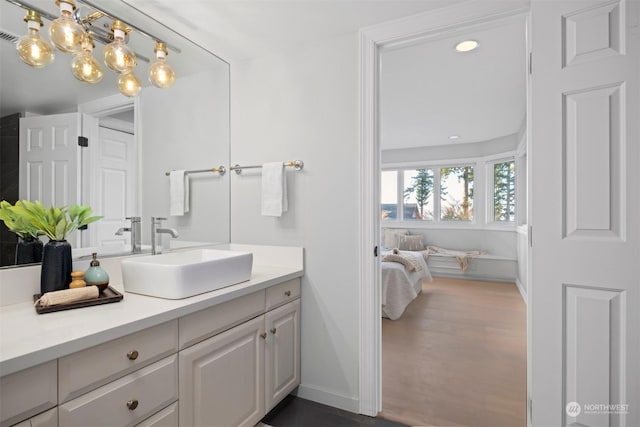 bathroom featuring vanity and hardwood / wood-style floors