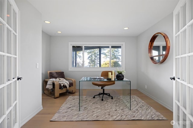 office space with french doors and light wood-type flooring