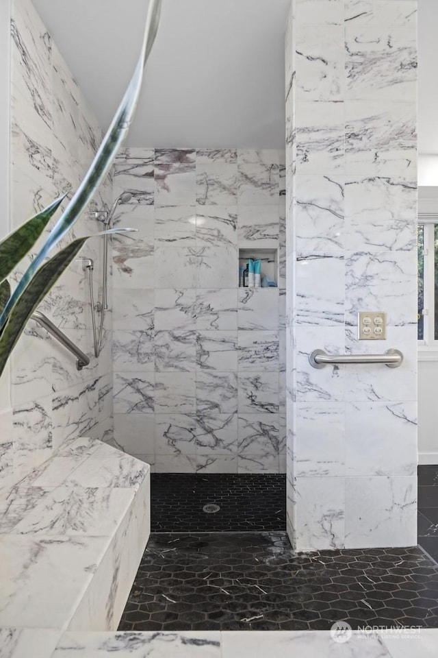 bathroom featuring tiled shower