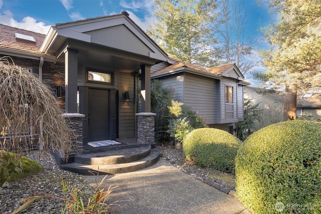 view of exterior entry featuring stone siding