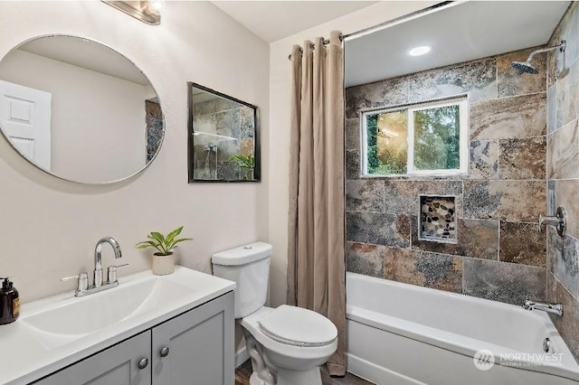 full bathroom featuring vanity, toilet, and shower / bathtub combination with curtain