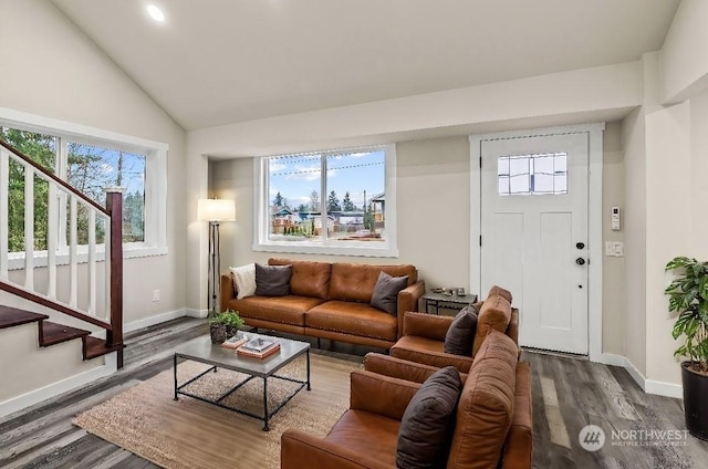 living room featuring lofted ceiling and dark hardwood / wood-style floors