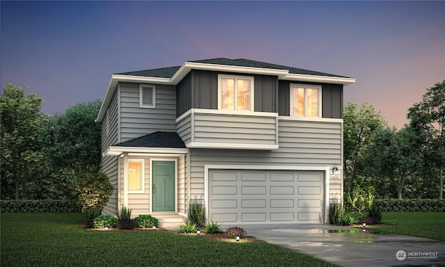 view of front facade with a garage, board and batten siding, driveway, and a yard