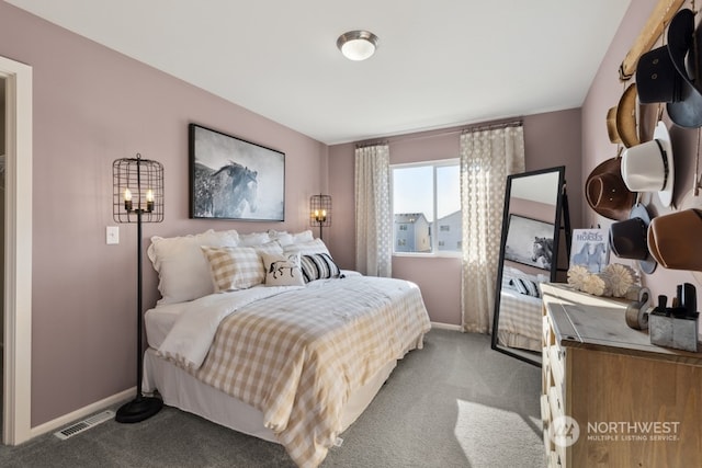 carpeted bedroom with baseboards and visible vents