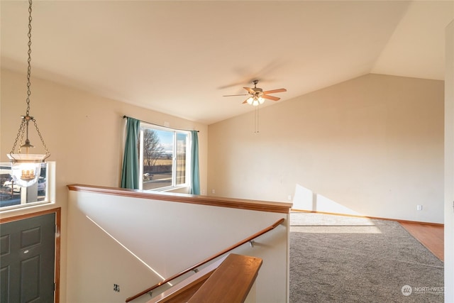 interior space featuring vaulted ceiling and carpet