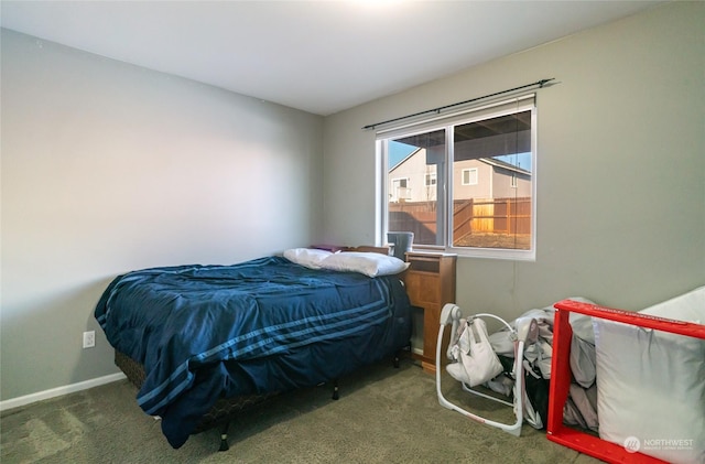 bedroom featuring dark colored carpet