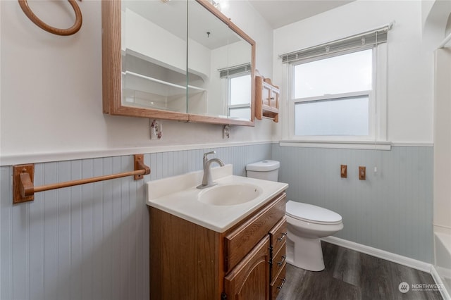 bathroom featuring vanity, toilet, and hardwood / wood-style floors