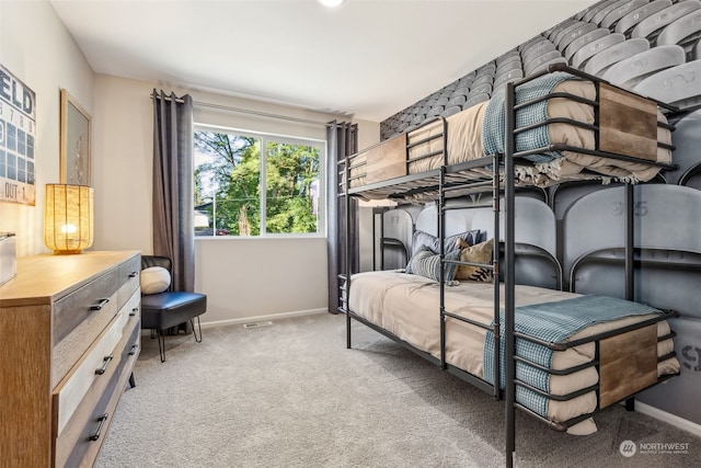 bedroom featuring light colored carpet