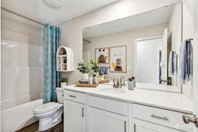 full bathroom featuring vanity, hardwood / wood-style flooring, toilet, and shower / bath combo with shower curtain