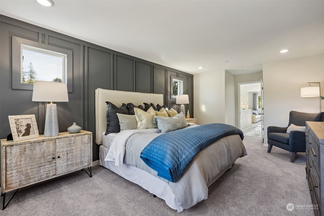 bedroom with light colored carpet