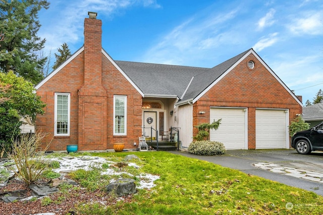 view of front of house featuring a garage and a front yard