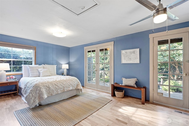 bedroom featuring access to exterior, light hardwood / wood-style flooring, and ceiling fan