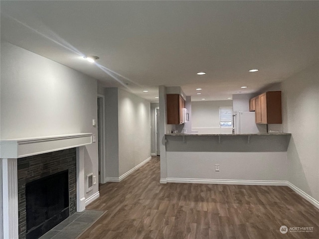 unfurnished living room featuring dark wood-type flooring