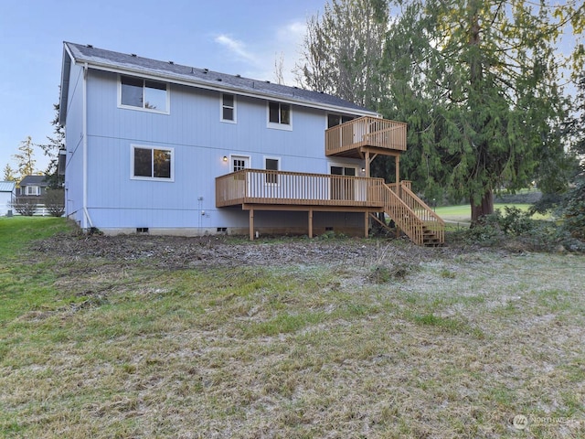 rear view of property with a wooden deck