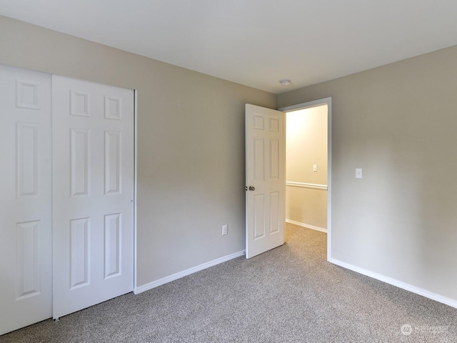 unfurnished bedroom with light carpet