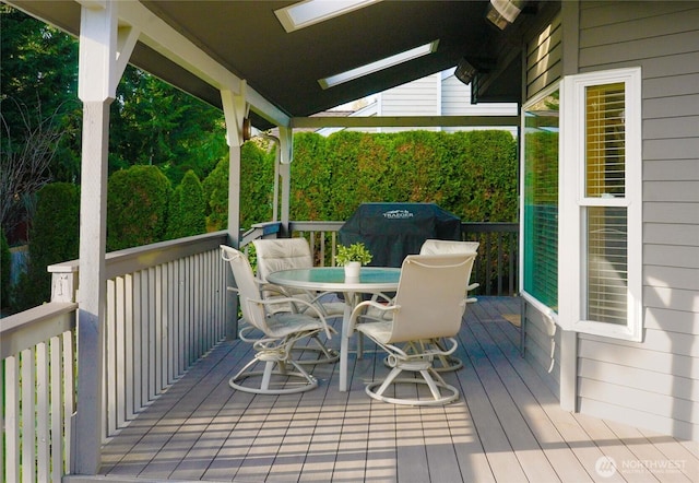 wooden deck with outdoor dining space