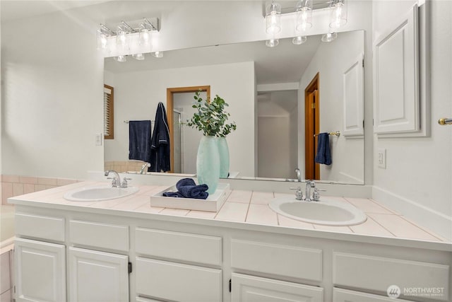 bathroom featuring double vanity and a sink