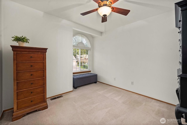 unfurnished bedroom with visible vents, carpet flooring, a ceiling fan, and baseboards