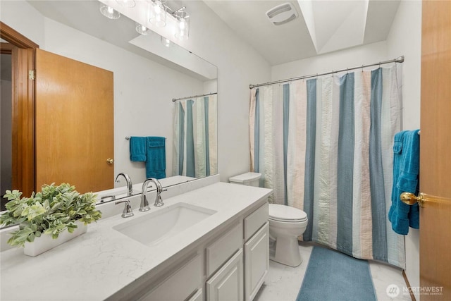 bathroom with vanity, toilet, a shower with curtain, and visible vents