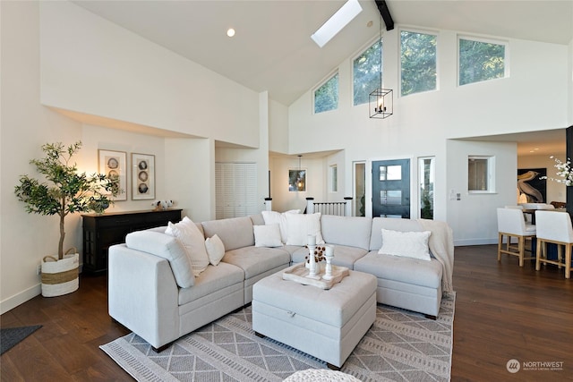 living room featuring dark hardwood / wood-style flooring and lofted ceiling with skylight