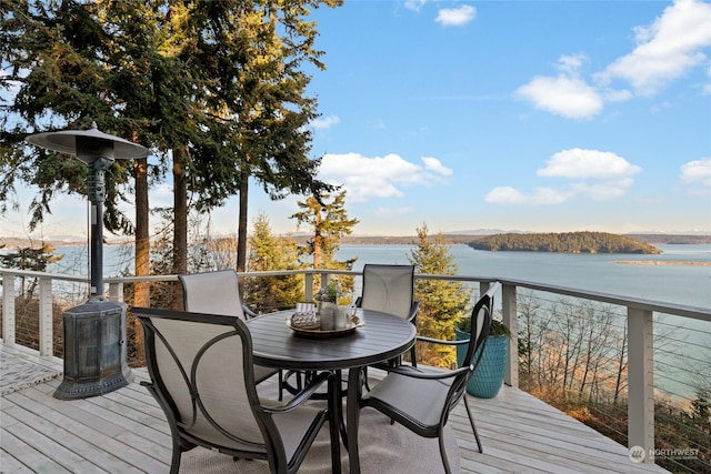 wooden terrace featuring a water view