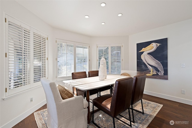 dining area with dark wood-type flooring