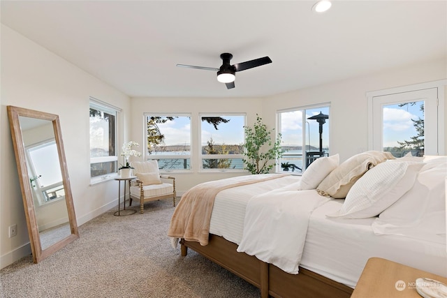 bedroom with ceiling fan and carpet flooring