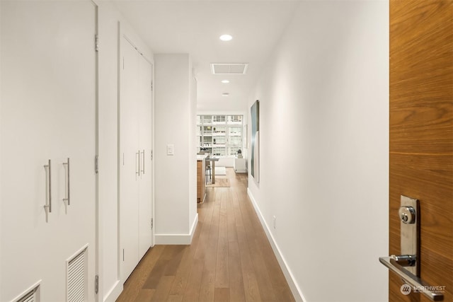 hallway featuring hardwood / wood-style floors