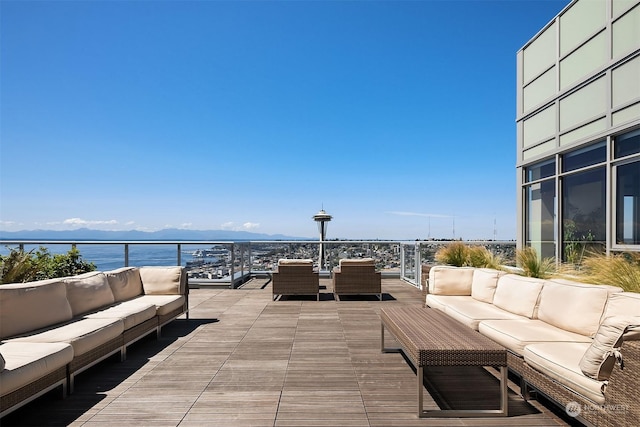 view of patio featuring an outdoor hangout area and a water and mountain view