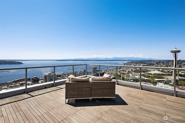 deck featuring a water and mountain view