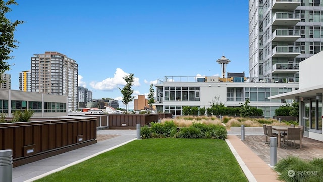 view of community featuring a patio and a yard