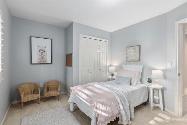 carpeted bedroom with a closet