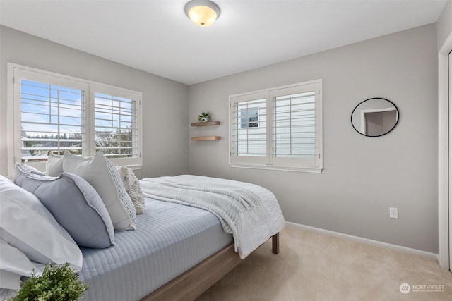 bedroom with light carpet