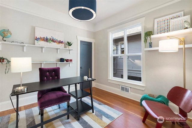 office area with hardwood / wood-style floors