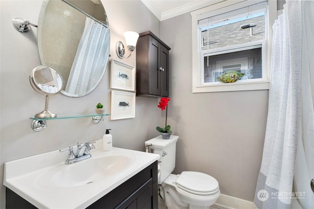 bathroom with ornamental molding, vanity, and toilet