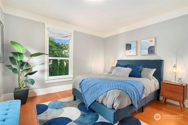 bedroom with wood-type flooring