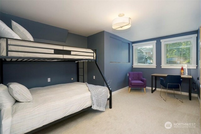 bedroom with light colored carpet