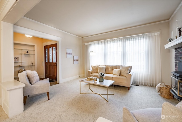 carpeted living room with built in shelves, ornamental molding, and a wood stove